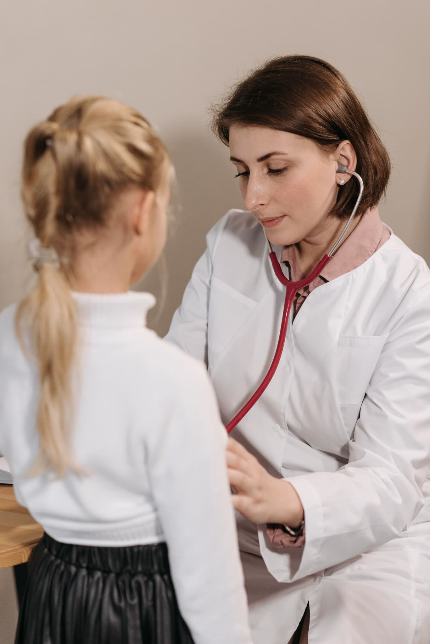 A doctor providing ongoing medical care to a patient