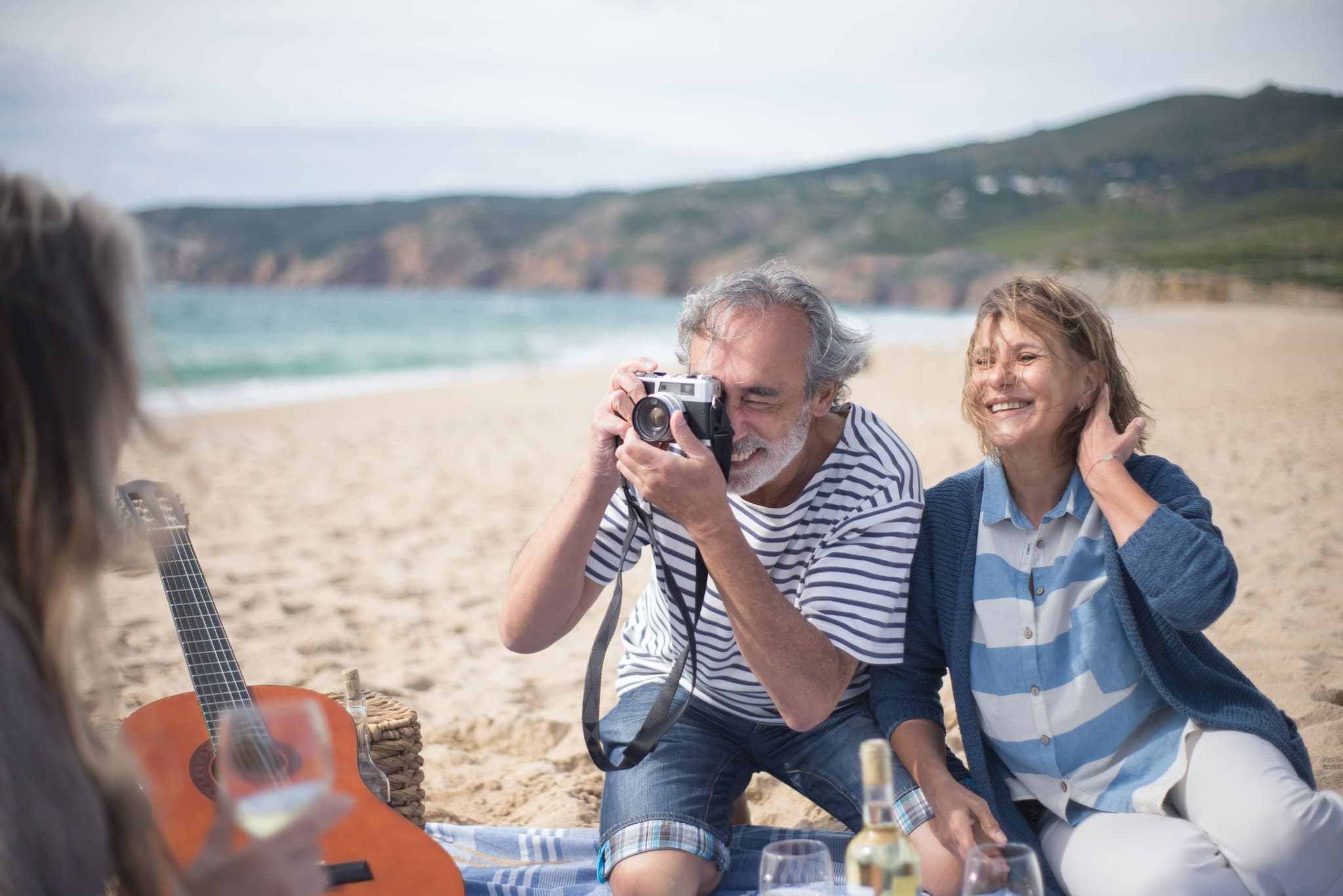Older couple enjoying time together on a beach